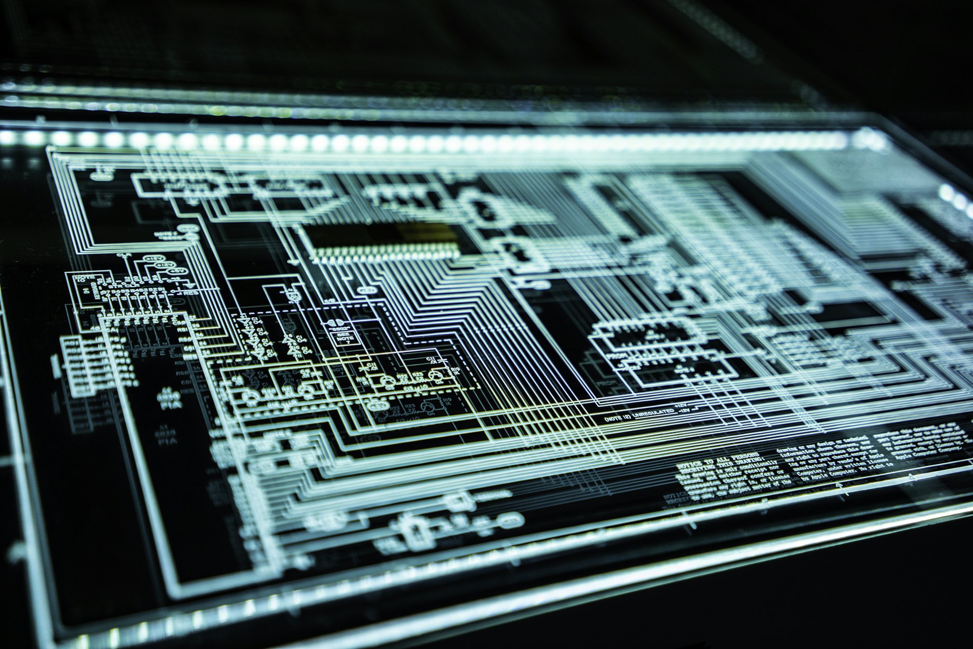Close-up of an illuminated circuit board schematic